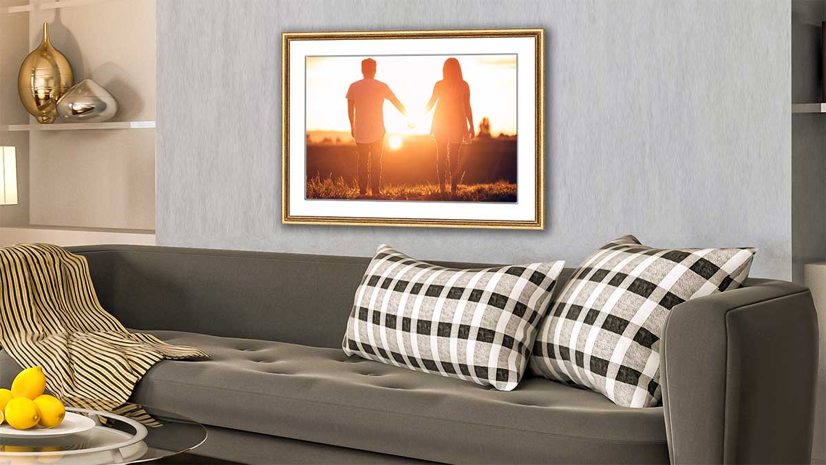 Framed photo of a couple strolling in the sunset hung in a sitting room