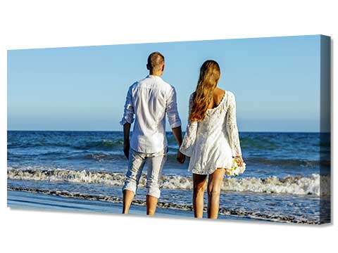 Framed poster of a couple holding hands in the sunset
