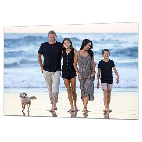 Family photo featuring a day at the seaside with their dog