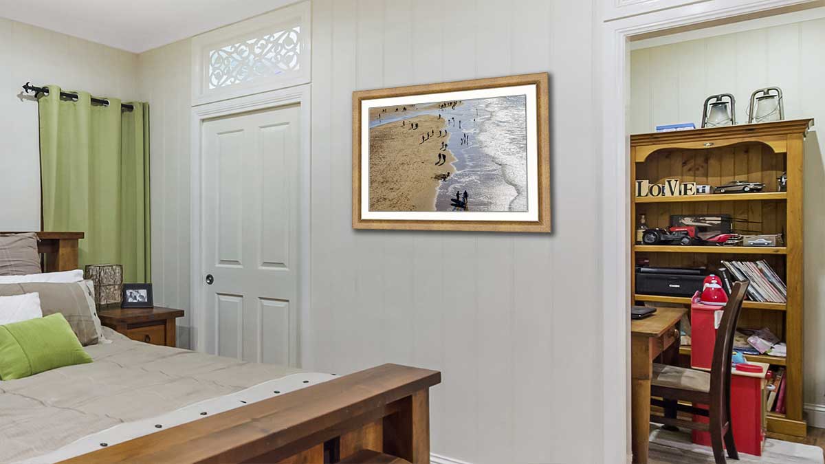 Family day out at the seaside captured in a lovely photo, then displayed in a frame that brings out the colours of the wall paper in the room