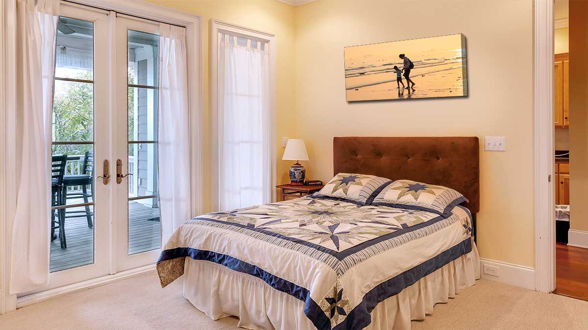 Snowcapped mountain printed on canvas and hung in a bedroom