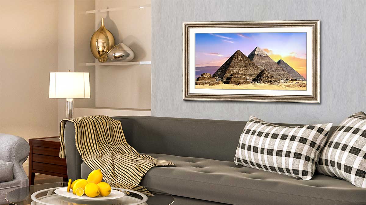 Holiday picture of the pyramids framed and hung above a settee