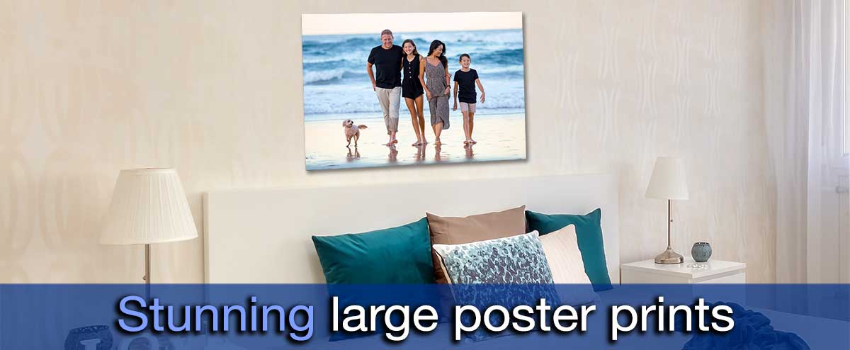 Picture of a bedroom with a poster showing a family day at the beach